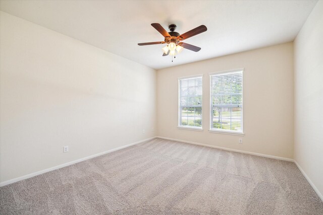22611 Pineleigh Ct, Tomball, TX 77375 - carpeted spare room with baseboards and a ceiling fan