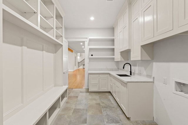 6001 Norhill Blvd, Houston, TX 77009 - mudroom with a sink, light stone finish flooring, and recessed lighting