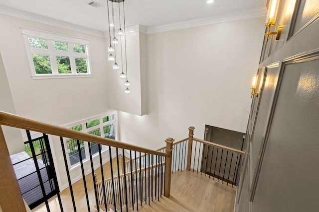 6001 Norhill Blvd, Houston, TX 77009 - stairs featuring wood finished floors, crown molding, and recessed lighting