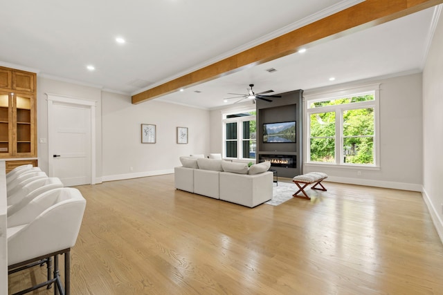 6001 Norhill Blvd, Houston, TX 77009 - living room with baseboards, light wood finished floors, recessed lighting, a fireplace, and ornamental molding