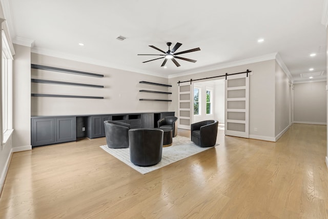 6001 Norhill Blvd, Houston, TX 77009 - living area featuring a barn door, ceiling fan, light wood-style floors, recessed lighting, and ornamental molding