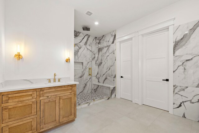 6001 Norhill Blvd, Houston, TX 77009 - full bath featuring a marble finish shower, vanity, recessed lighting, and marble finish floors