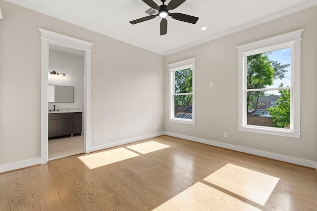 6001 Norhill Blvd, Houston, TX 77009 - unfurnished room featuring plenty of natural light, a ceiling fan, light wood finished floors, crown molding, and a sink