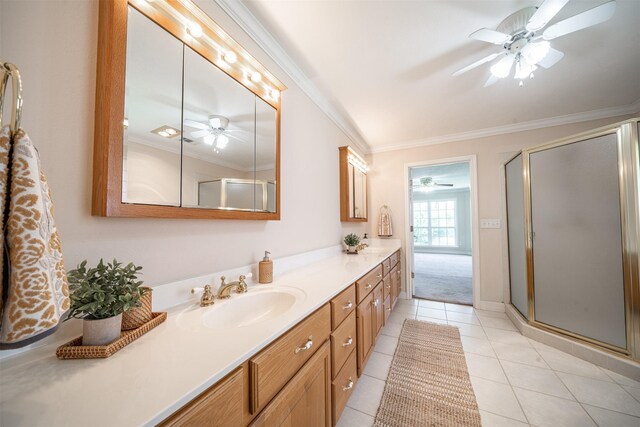 918 Dogwood Ridge Dr, Diboll, TX 75941 - bathroom with a ceiling fan, vanity, crown molding, a shower stall, and tile patterned flooring