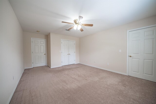 918 Dogwood Ridge Dr, Diboll, TX 75941 - unfurnished bedroom with light carpet, baseboards, a ceiling fan, and a closet