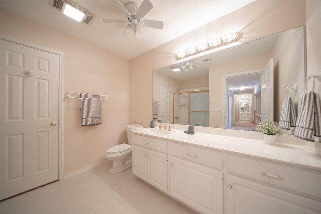 918 Dogwood Ridge Dr, Diboll, TX 75941 - full bathroom featuring a stall shower, ceiling fan, vanity, tile patterned flooring, and baseboards