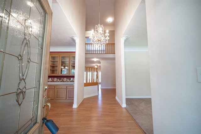 918 Dogwood Ridge Dr, Diboll, TX 75941 - entrance foyer featuring a chandelier, baseboards, and light wood-style floors