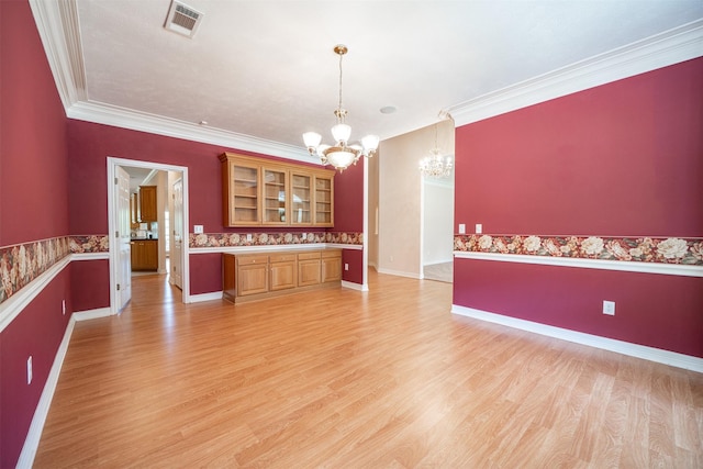 918 Dogwood Ridge Dr, Diboll, TX 75941 - interior space with a chandelier, crown molding, light wood finished floors, glass insert cabinets, and light countertops