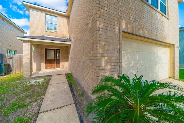 22802 Sherioaks Ln, Spring, TX 77389 - view of exterior entry with brick siding and a garage