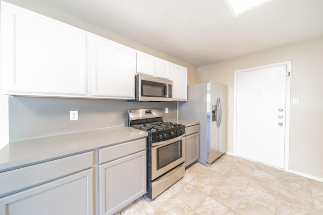 22802 Sherioaks Ln, Spring, TX 77389 - kitchen featuring stainless steel appliances, white cabinets, and light countertops