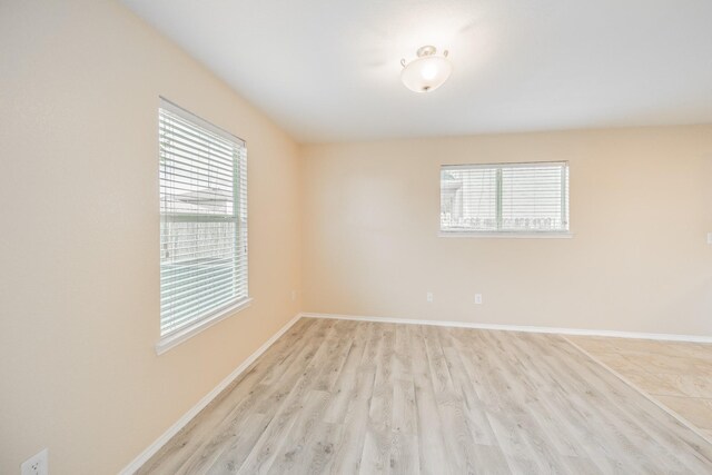 22802 Sherioaks Ln, Spring, TX 77389 - spare room with light wood-type flooring and baseboards