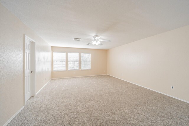 22802 Sherioaks Ln, Spring, TX 77389 - spare room featuring a ceiling fan, light colored carpet, and baseboards
