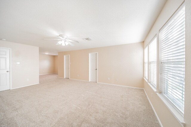 22802 Sherioaks Ln, Spring, TX 77389 - empty room featuring healthy amount of natural light, light carpet, and ceiling fan
