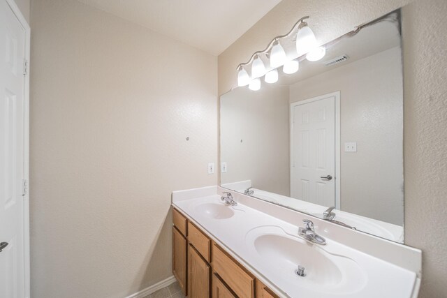 22802 Sherioaks Ln, Spring, TX 77389 - bathroom with double vanity and baseboards