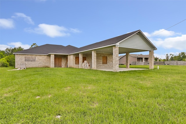 332 County Road 3567, Cleveland, TX 77327 - back of house with a lawn, a patio, and a carport