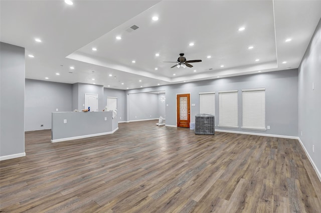 332 County Road 3567, Cleveland, TX 77327 - unfurnished living room with a raised ceiling, wood finished floors, a ceiling fan, and recessed lighting