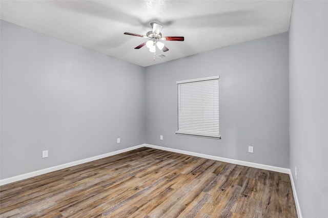 332 County Road 3567, Cleveland, TX 77327 - unfurnished room with a ceiling fan and wood finished floors