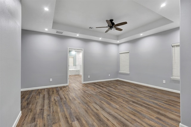 332 County Road 3567, Cleveland, TX 77327 - empty room with a raised ceiling, recessed lighting, ceiling fan, and dark wood-type flooring