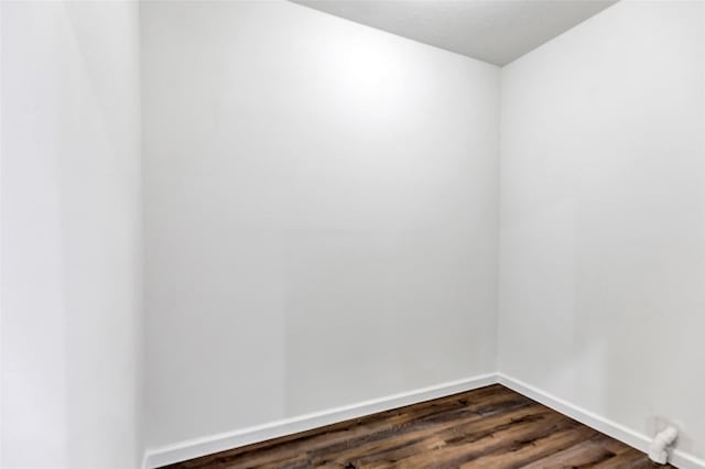 332 County Road 3567, Cleveland, TX 77327 - empty room featuring dark wood-style flooring and baseboards