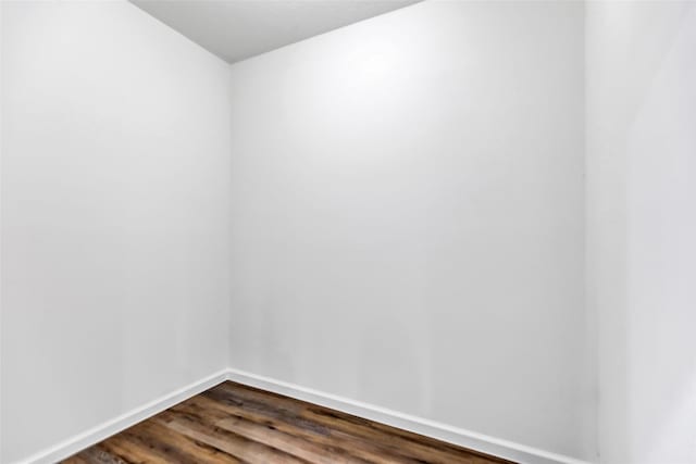 332 County Road 3567, Cleveland, TX 77327 - unfurnished room featuring dark wood-type flooring and baseboards