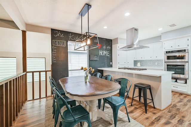 20002 18th Fairway Dr, Humble, TX 77346 - dining space featuring light wood-style floors and recessed lighting