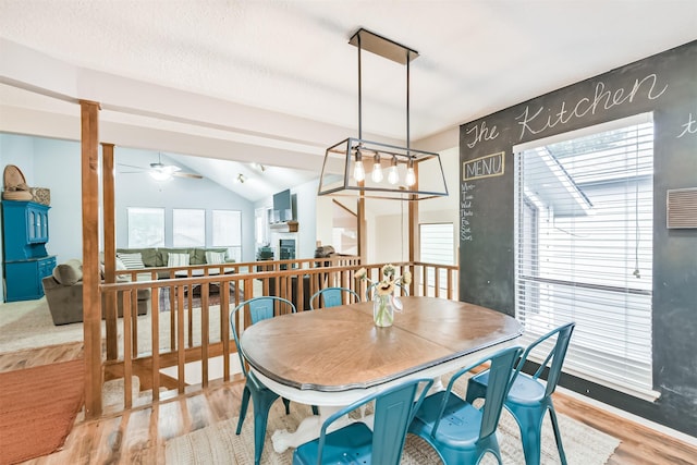 20002 18th Fairway Dr, Humble, TX 77346 - dining space featuring wood finished floors, vaulted ceiling, and a ceiling fan