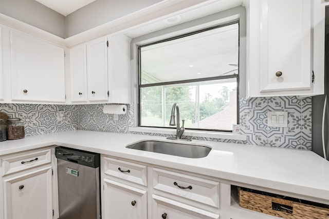 20002 18th Fairway Dr, Humble, TX 77346 - kitchen featuring stainless steel dishwasher, a sink, light countertops, white cabinets, and tasteful backsplash