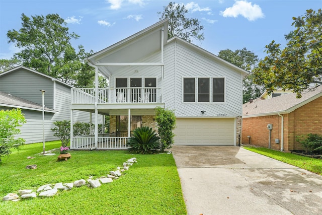 20002 18th Fairway Dr, Humble, TX 77346 - view of front of property with an attached garage, a front lawn, a balcony, driveway, and a porch