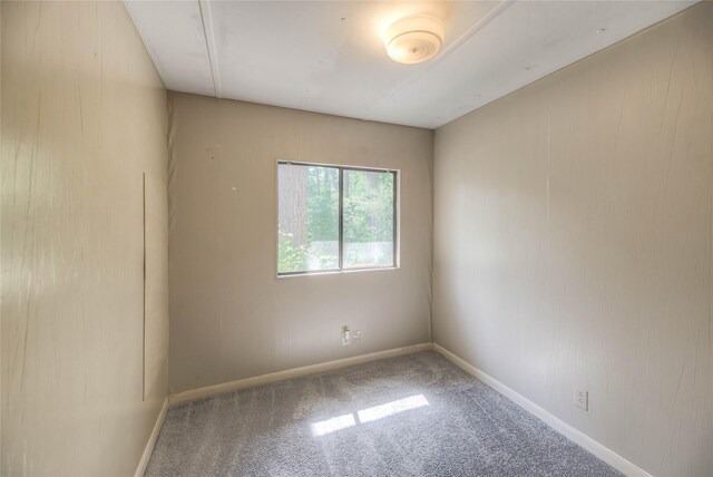 330 Oak Tree Dr, Point Blank, TX 77364 - unfurnished room featuring carpet floors and baseboards