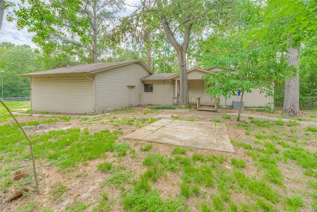 330 Oak Tree Dr, Point Blank, TX 77364 - back of house with central AC unit