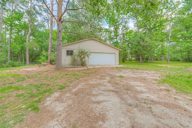 330 Oak Tree Dr, Point Blank, TX 77364 - detached garage featuring view of wooded area