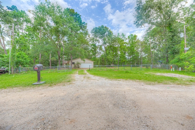 330 Oak Tree Dr, Point Blank, TX 77364 - view of yard with a detached garage and view of scattered trees