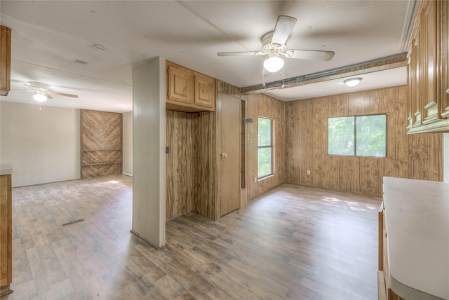 330 Oak Tree Dr, Point Blank, TX 77364 - empty room featuring ceiling fan, light wood-style floors, and wooden walls