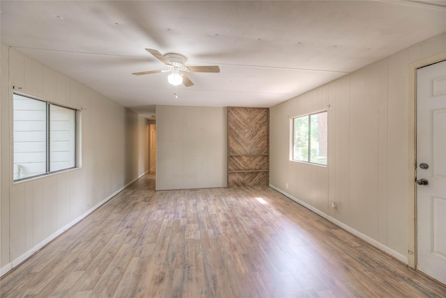 330 Oak Tree Dr, Point Blank, TX 77364 - empty room with wood finished floors, ceiling fan, and baseboards