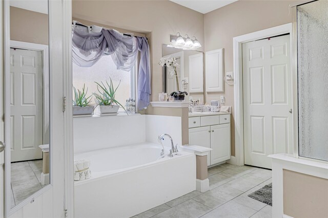 16946 Creek Mountain Dr, Houston, TX 77084 - full bath featuring vanity, a bath, tile patterned flooring, and a shower