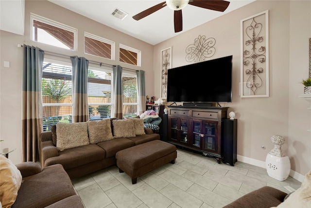 16946 Creek Mountain Dr, Houston, TX 77084 - living room featuring a ceiling fan, light tile patterned floors, and baseboards