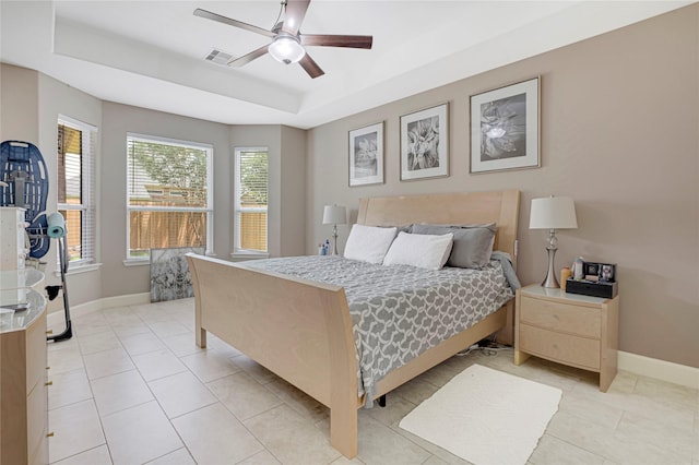 16946 Creek Mountain Dr, Houston, TX 77084 - bedroom with a raised ceiling, baseboards, light tile patterned floors, and ceiling fan