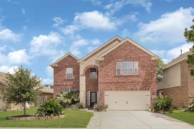 16946 Creek Mountain Dr, Houston, TX 77084 - traditional-style home featuring an attached garage, brick siding, and driveway