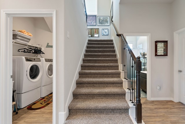 25718 Balsamwood Dr, Tomball, TX 77375 - staircase with separate washer and dryer, wood finished floors, and healthy amount of natural light