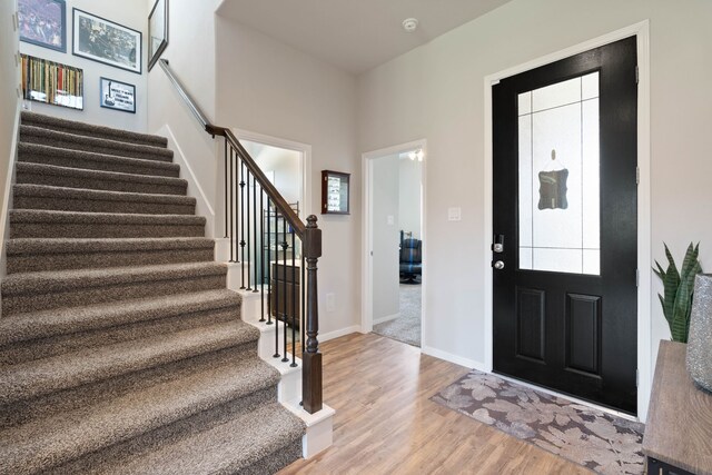 25718 Balsamwood Dr, Tomball, TX 77375 - entrance foyer featuring stairs and light wood finished floors
