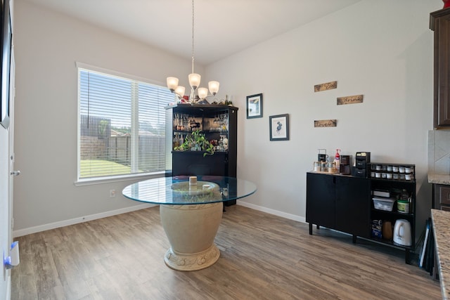 25718 Balsamwood Dr, Tomball, TX 77375 - dining space featuring wood finished floors and a chandelier