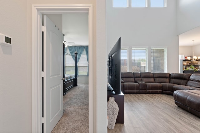 25718 Balsamwood Dr, Tomball, TX 77375 - living room featuring a chandelier, healthy amount of natural light, and a ceiling fan