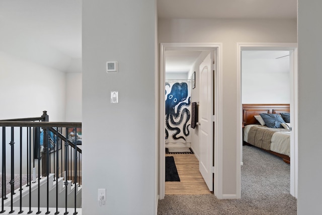 25718 Balsamwood Dr, Tomball, TX 77375 - corridor featuring carpet flooring and an upstairs landing