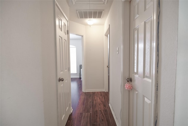 13614 Birch Canyon Ct, Houston, TX 77041 - hallway with attic access, dark wood-style flooring, and baseboards