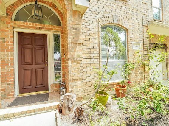 13614 Birch Canyon Ct, Houston, TX 77041 - doorway to property featuring brick siding
