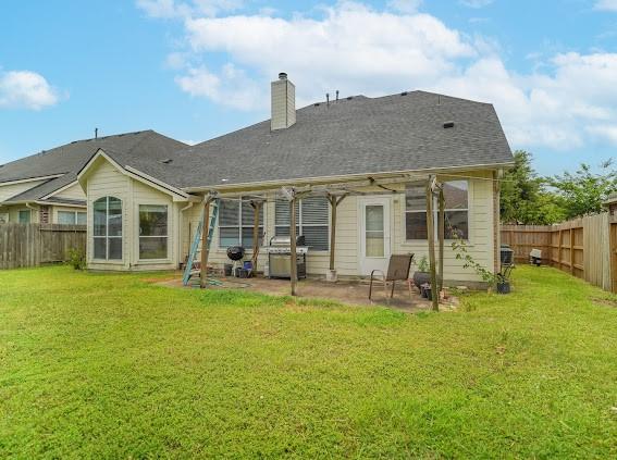 13614 Birch Canyon Ct, Houston, TX 77041 - back of property with a patio and a chimney