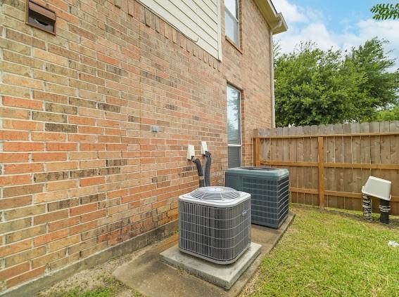 13614 Birch Canyon Ct, Houston, TX 77041 - exterior view of a central AC unit and brick siding