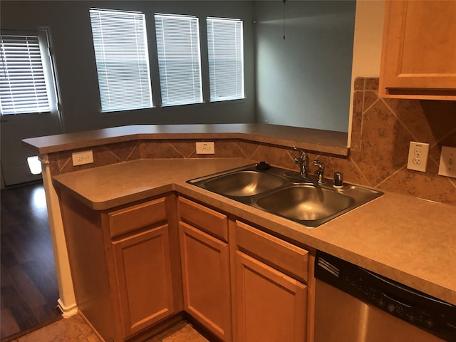 2726 Maybrook Hollow Ln, Houston, TX 77047 - kitchen with stainless steel dishwasher, a sink, backsplash, and light countertops