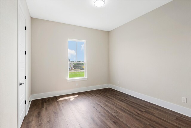 1437 Bluebonnet Ridge Dr, Chappell Hill, TX 77426 - spare room with dark wood-style floors and baseboards