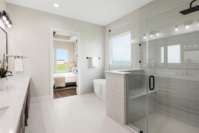 1437 Bluebonnet Ridge Dr, Chappell Hill, TX 77426 - full bath with double vanity, a shower stall, a freestanding tub, and ensuite bath